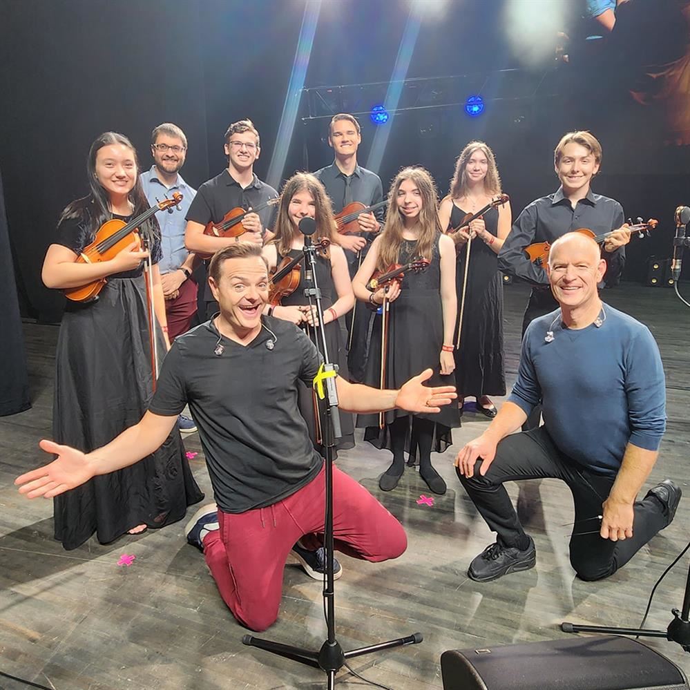  CPHS students pictured with the Piano Guys during soundcheck